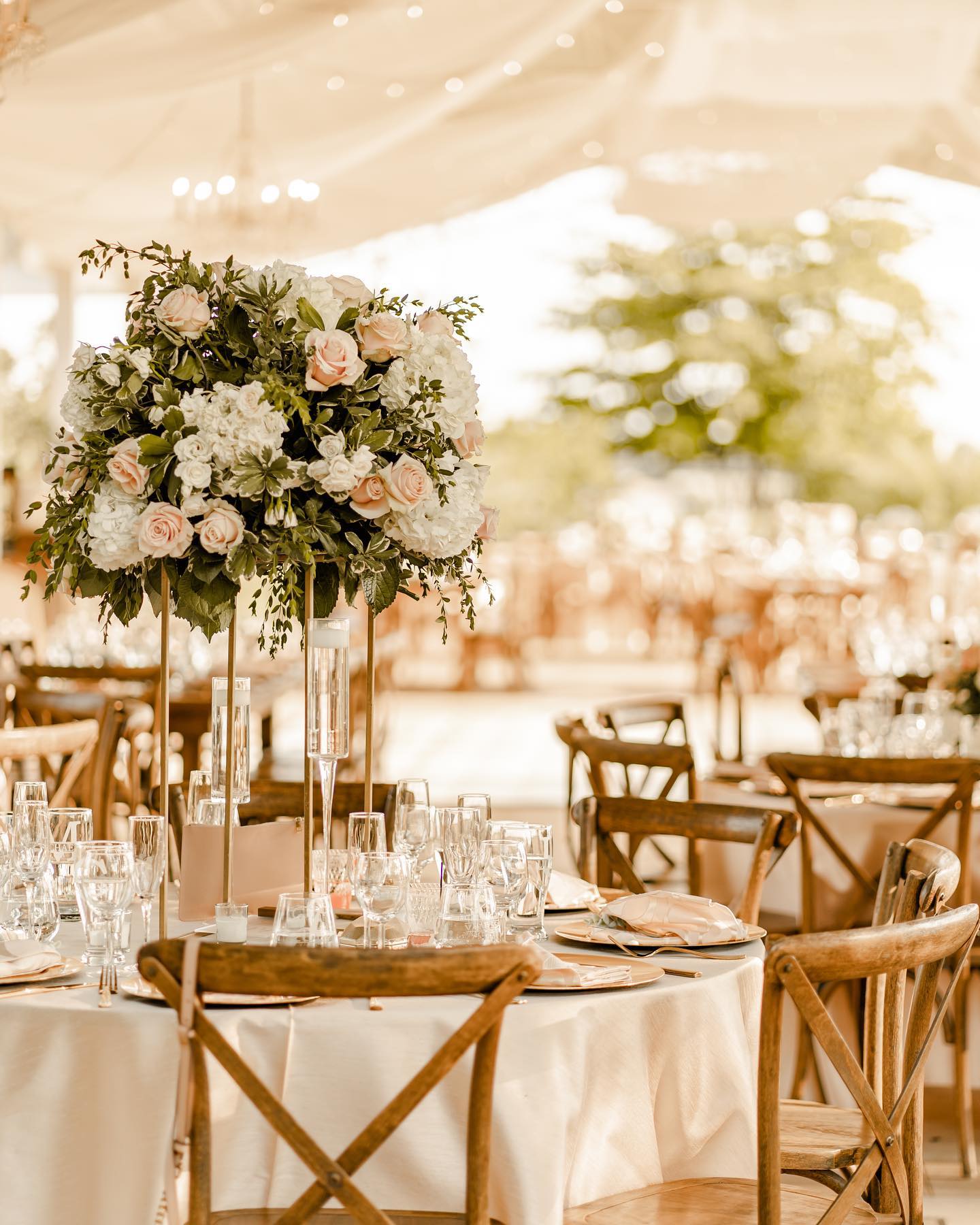 Floral tablescape in the covered reception area at Cinco Farm in Miami